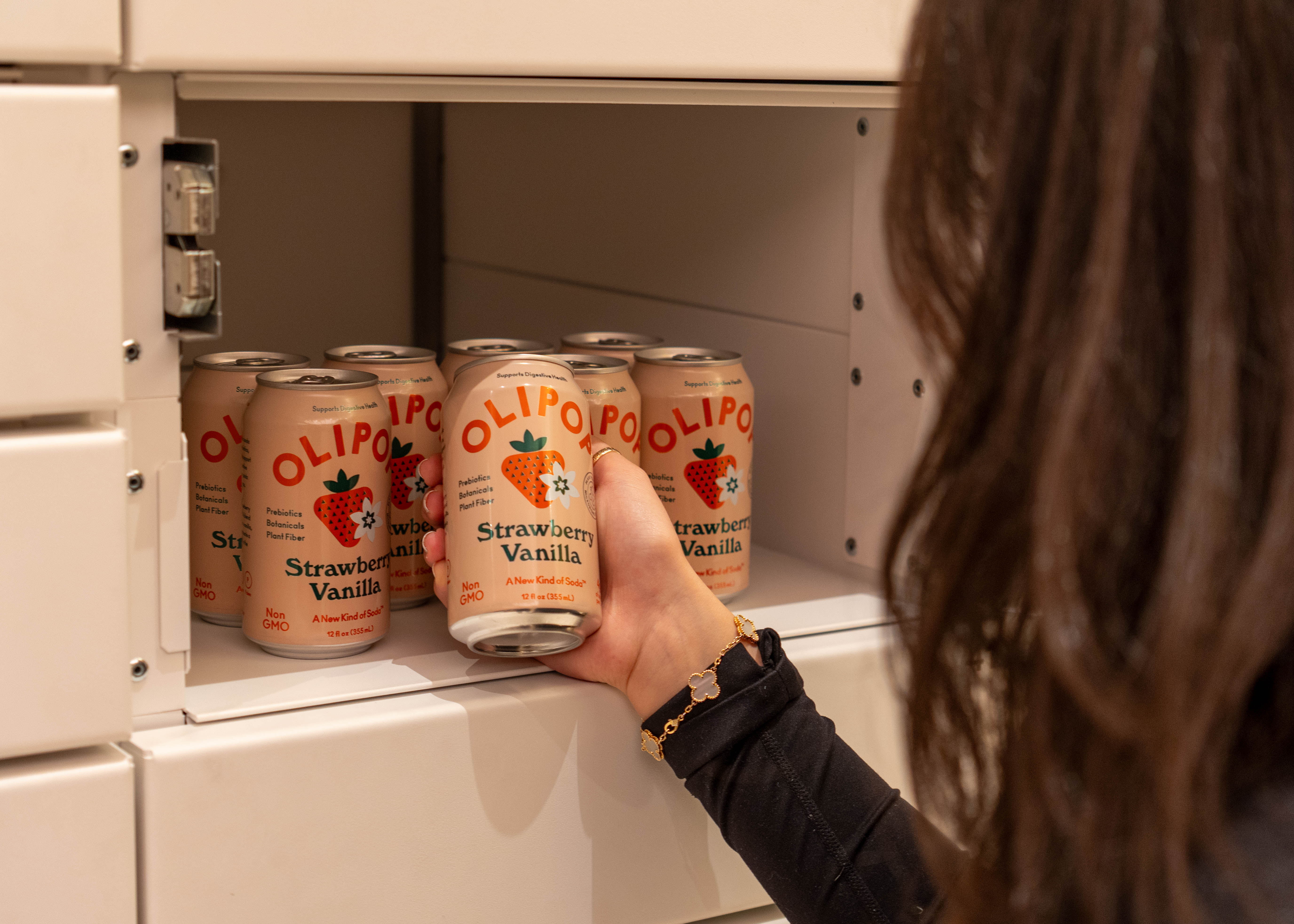 Resident picking up Olipop from Placement locker